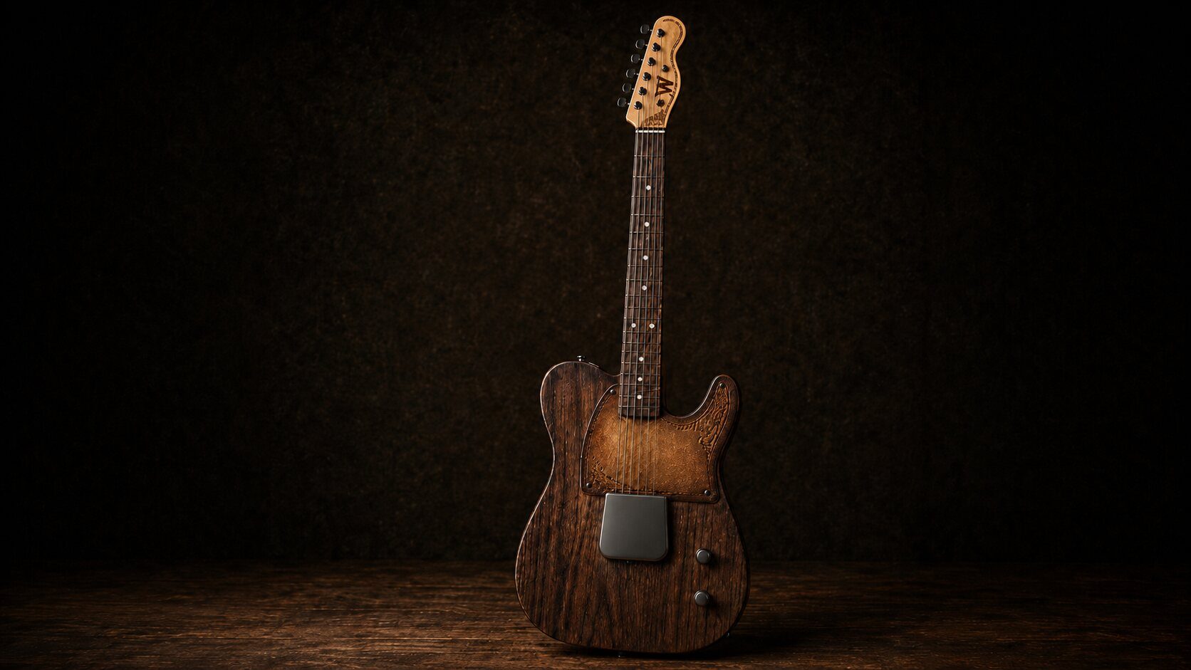 The Jack custom electric guitar, full view with gunmetal hardware against a dark workshop backdrop. Walnut body with fire-colored steel and blackened nickel ashtray bridge cover.